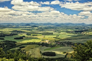 Fototapeta na wymiar Czech rural landscape with green fields and villages