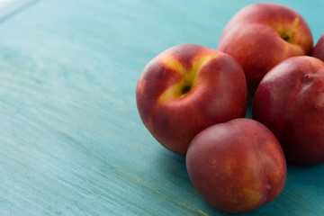 Nectarines on a blue wooden table