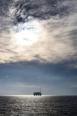 silhouette of an oil drilling rig in the North Sea