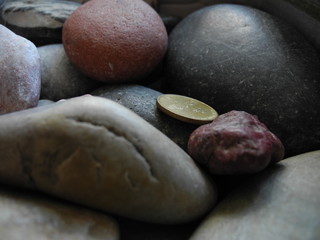 Fototapeta na wymiar lost coin on pebbles