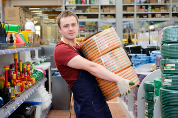 seller in building equipment tools store at work