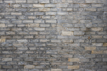 Old grey brick wall texture background