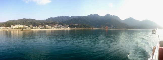 Panoramic view of an afternoon boat ride (ferry) on the ocean to the UNESCO World Heritage Site,...