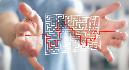 Businessman searching solution of a complicated maze