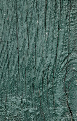 Green texture with stains from paint on wood