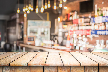 Empty wood top table with space for display product in Blurred cafe background.