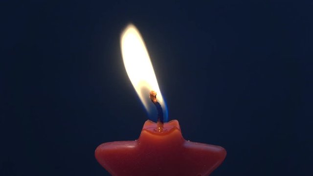 Flickering star candle close up