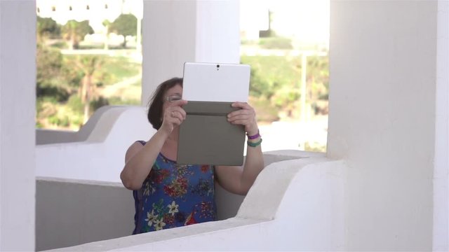 High quality video of senior woman taking a picture on the vacation in real 1080p slow motion 250fps