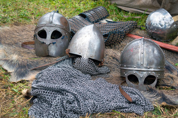 Medieval knight regimentals: metal helmets and chain armour