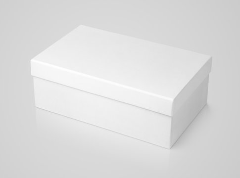 Closed shoe white paper box on gray background with clipping path