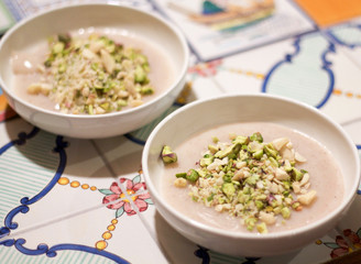 homemade pudding blancmange decorated with  almond and pistachio grain