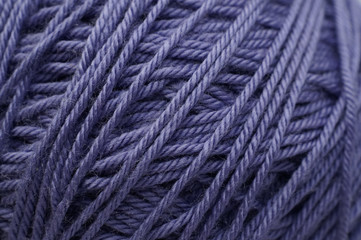 Ball of lilac yarn. Closeup texture