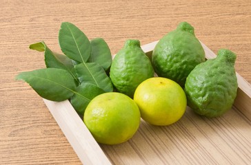 Kaffir Lime with Lemon Lime on A Wooden Tray