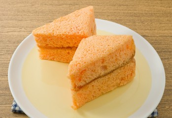 Two Orange Chiffon Cake on A Dish