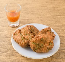 Thai Fish Cakes Served on A White Plate