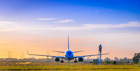 Fototapeta na wymiar Front of airplane at sunset