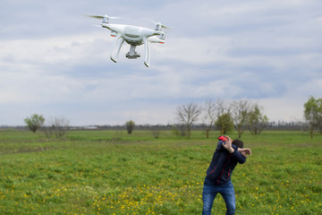 A man hides himself from a collision with a drone. Quadrocopter