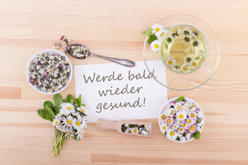 Get well / Card for recovery with tea and daisies and German text:  Get well soon!