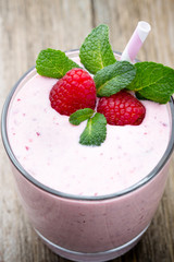 Raspberry milk shake with mint decor.