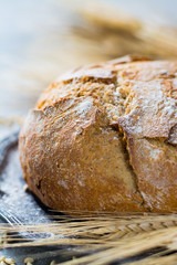 Freshly baked traditional wheat bread and wheat ears