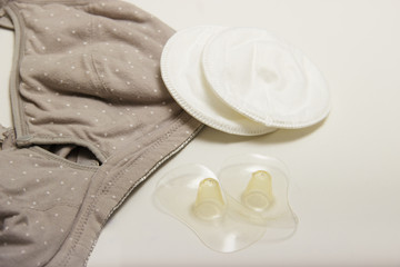 Nursing bra for mothers and Silicon nipples. moms bra with new disposable breast pad. Prevents the flow of milk on the clothes, it is convenient to unfasten the cups for feeding the baby