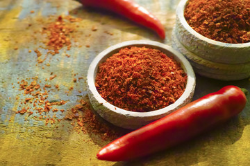 Red hot chili Cayenne pepper fresh and dried powdered spice, ready to use.