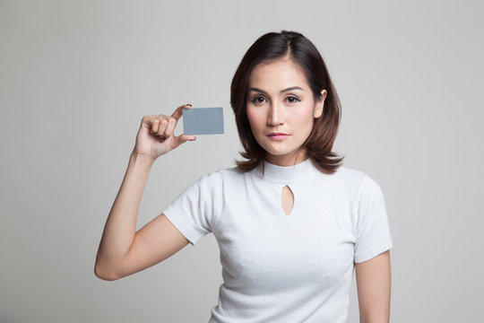 Young Asian woman with a blank card.
