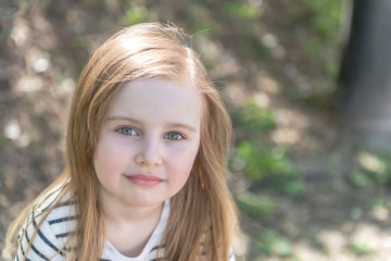 Naklejka premium little girl with long hair, closeup