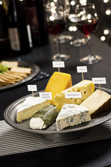Cheese Platter, Crackers, and Red Wine at a Holiday Cheese Tasting Party