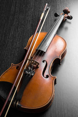Fototapeta na wymiar Old violin on a black background
