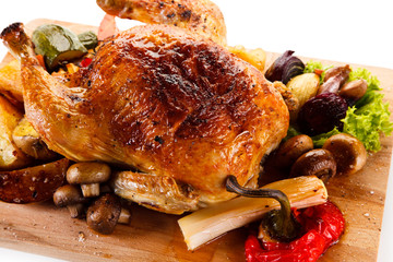 Roast chicken on cutting board 
