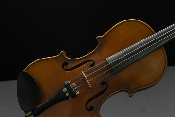 Fototapeta premium Old violin on a black background