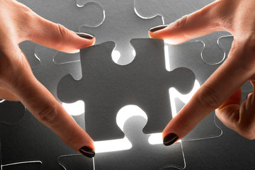 Hands holding puzzle pieces, business concept background
