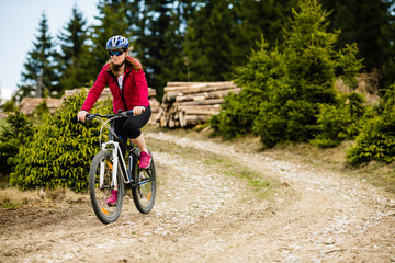 Middle-aged woman riding bicycle