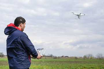 A man with a remote control in his hands. Flight control of the drone. Phantom