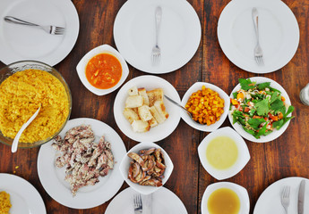 Top view of plates with different food on the table