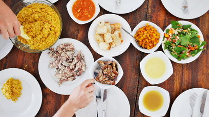 Top view of plates with different food on the table