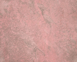 Pink grunge painted wall texture.