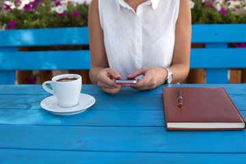 Young urban woman texting on the phone 