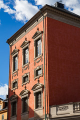 Obraz premium View of traditional red building of old town street in Stockholm at sunny day, Sweden
