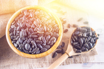 Fresh Sunflower seed. Shelled sunflower seeds in wood bowl.