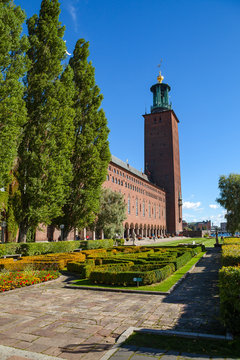 Tower of City Hall with park greenery in Stockholm, Sweden