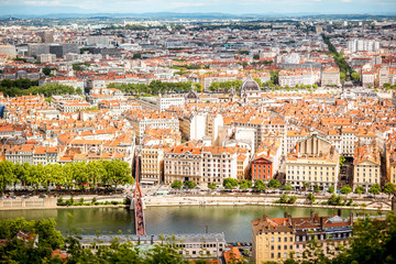 Fototapeta na wymiar Aerial cityscape view with beautiful old buildings and Rhone river in Lyon city