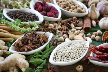 black pepper ,white pepper and ingredient  on wood background concept for herb and spicies background
