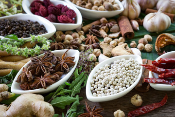 black pepper ,white pepper and ingredient  on wood background concept for herb and spicies background