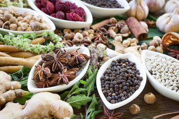 black pepper ,white pepper and ingredient  on wood background concept for herb and spicies background