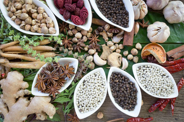 black pepper ,white pepper and ingredient  on wood background concept for herb and spicies background
