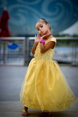 Naklejka premium yellow dress princeses modeling for camera