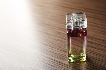 Perfume bottle on wooden table