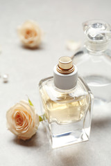 Obraz na płótnie Canvas Perfume bottles on grey background